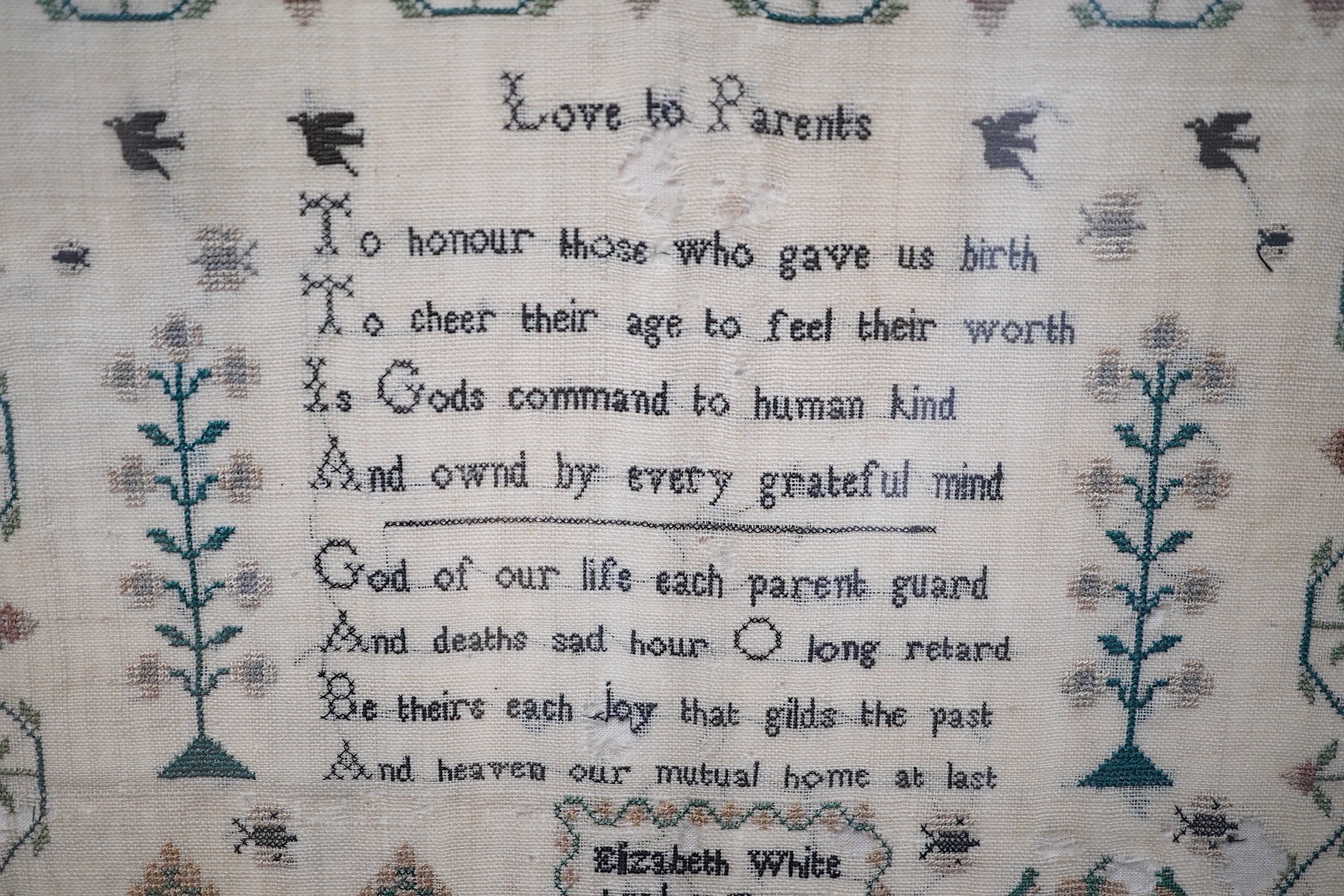 Two mid 19th century samplers worked by Elizabeth White, one dated 1842 aged 8 years, the other 1844 aged 11 years, both worked with a country scene of a house, birds, dogs and trees, the earlier sampler with a top panel